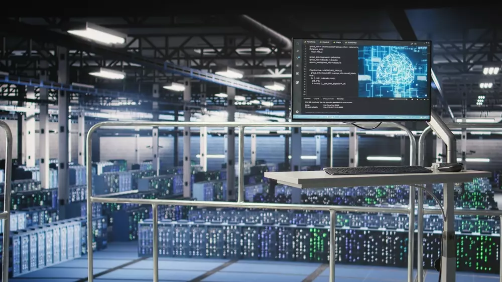 Centro de dados com monitor exibindo código e análise de pegada ambiental de IA, destacando a importância da sustentabilidade na tecnologia.