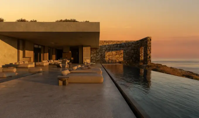 Design regenerativo na Grécia: vista de uma moderna construção com piscina de borda infinita, ambiente ao pôr do sol